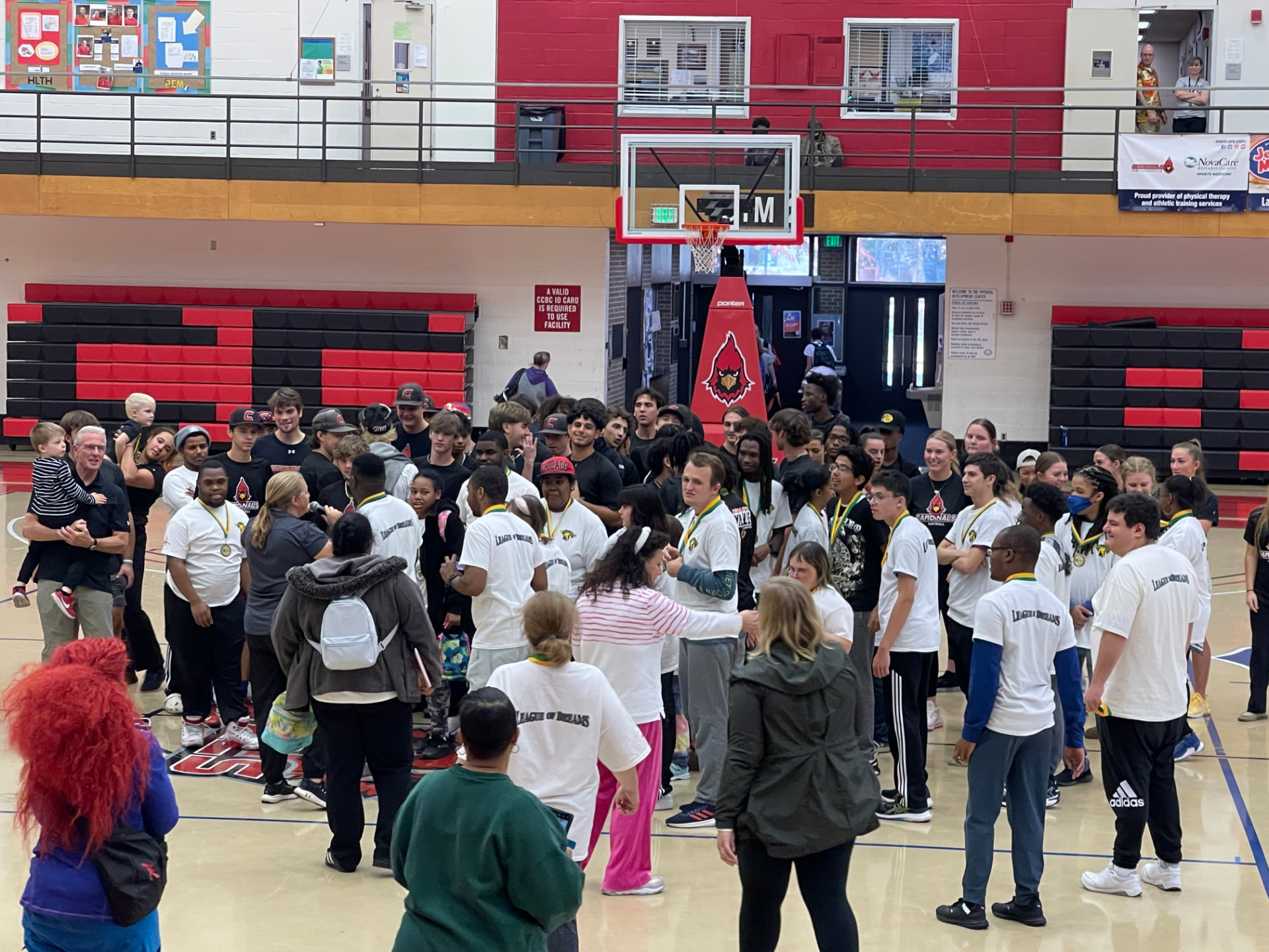 Athletes gathered in a gym for an awards ceremony