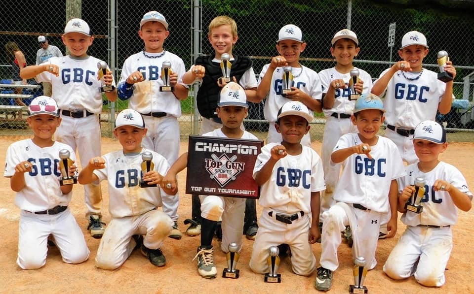 Youth baseball team celebrating a tournament championship
